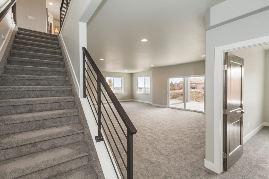 Calgary basement renovation under construction with framing, electrical wiring and recessed lighting installation
